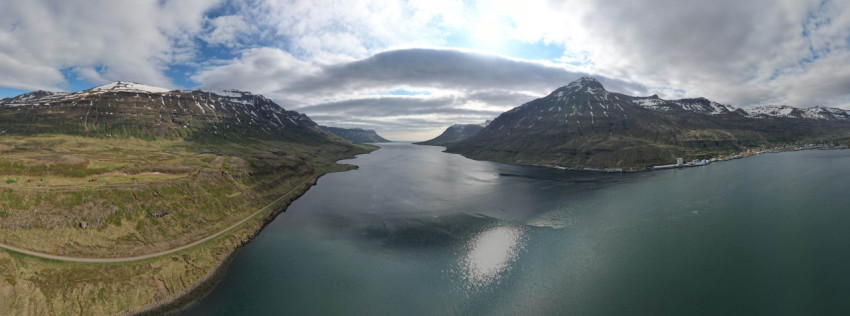 Aerial view of two mountains and a body of water