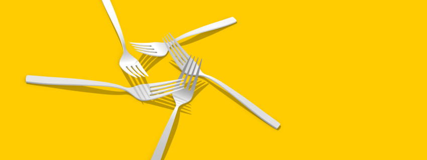 Fork on a yellow background. Forks for the design of a restaurant, cafe, pizzeria. Minimalistic kitchen fork design for advertising purposes