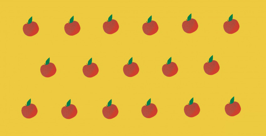 pattern of red apples on yellow background