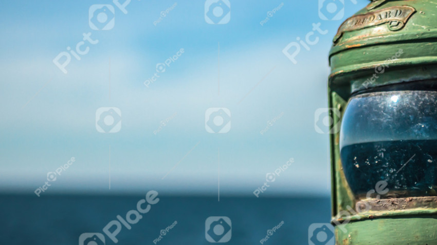 Aged green lantern on cruising yacht