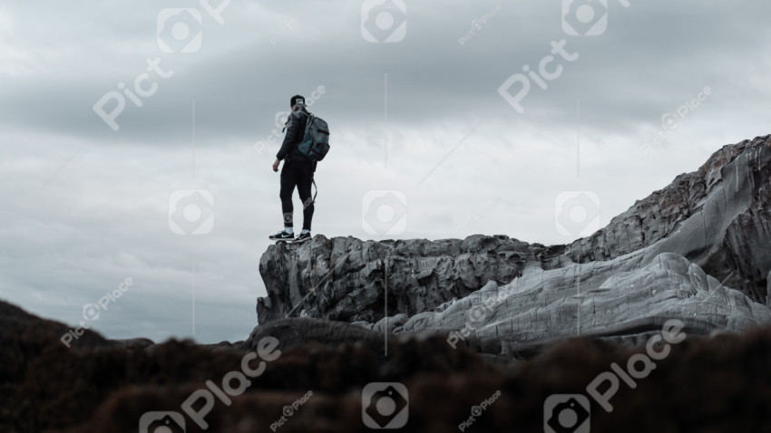 Man standing on the edge of a cliff