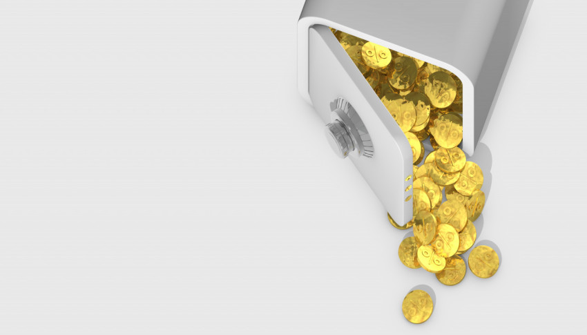 Open safe on a yellow background with coins spilling out. The accumulation of interest