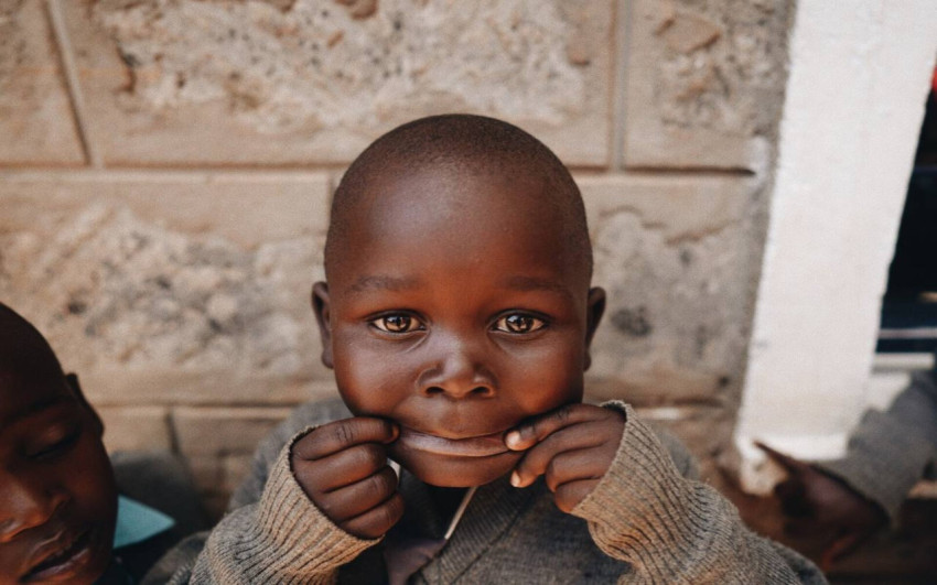 black boy makes faces in front of the camera