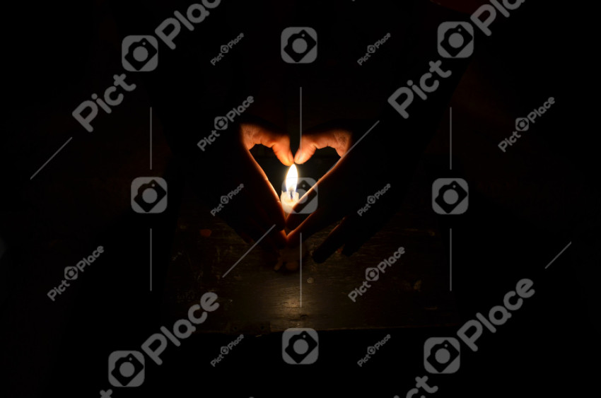 heart hands and candle