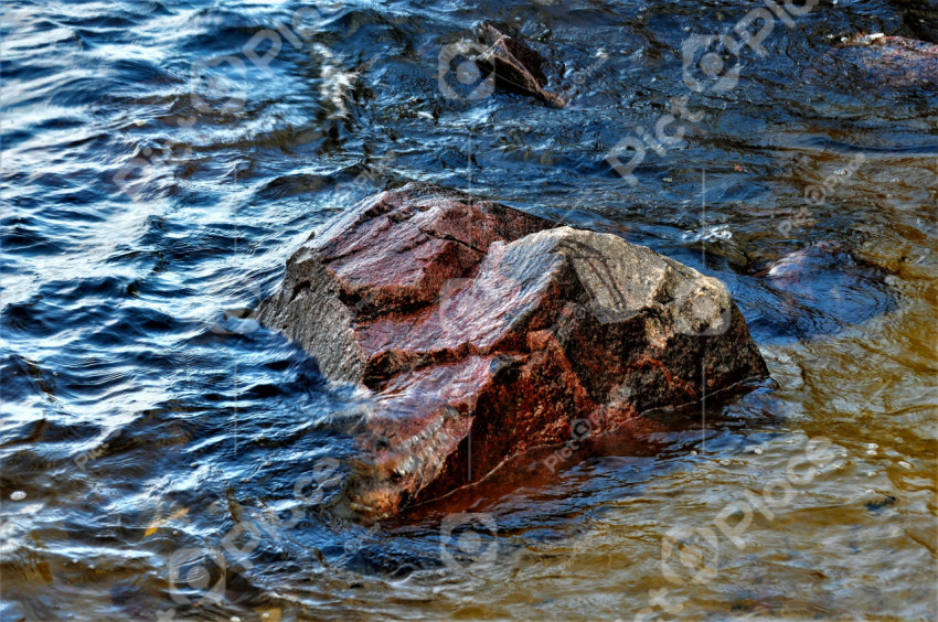 Big stone in the water