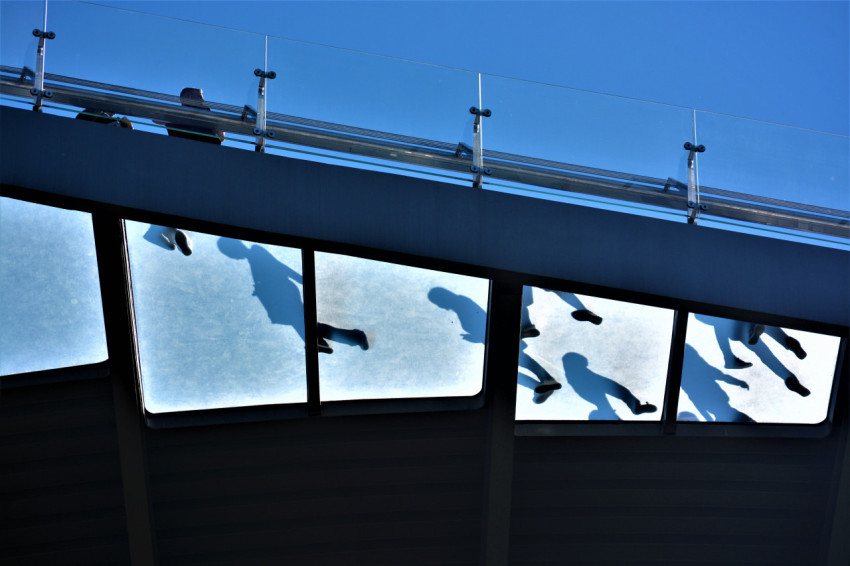 silhouettes of people, view under the bridge