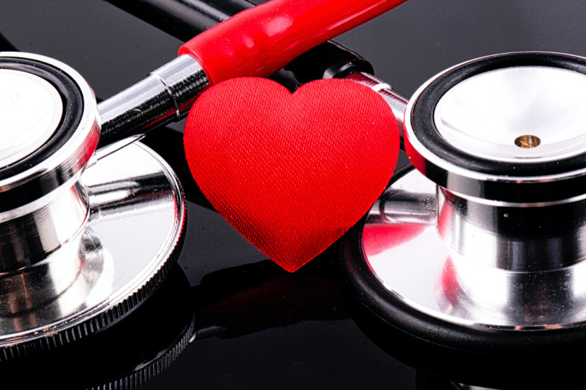 stethoscope and a heart on a table