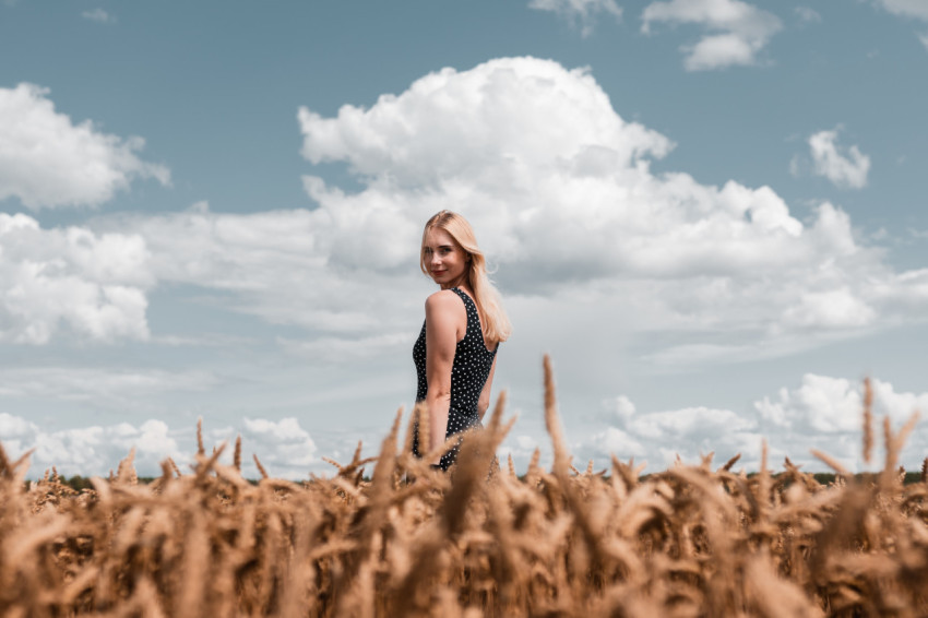 Woman standing on the grass of a field