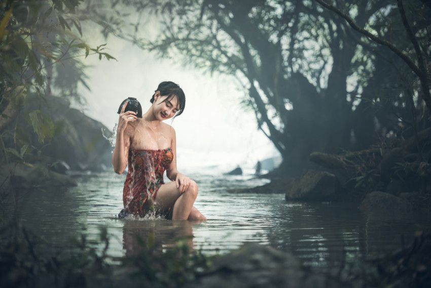 Woman bathing in the river