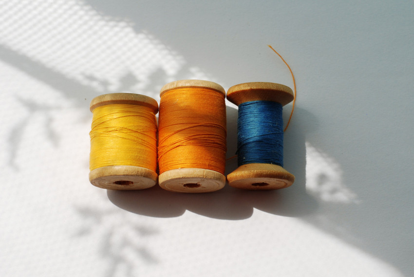 Three spools of thread