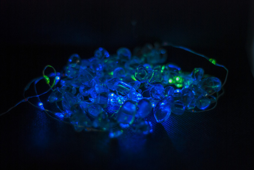 Beads on a background of blue-green light