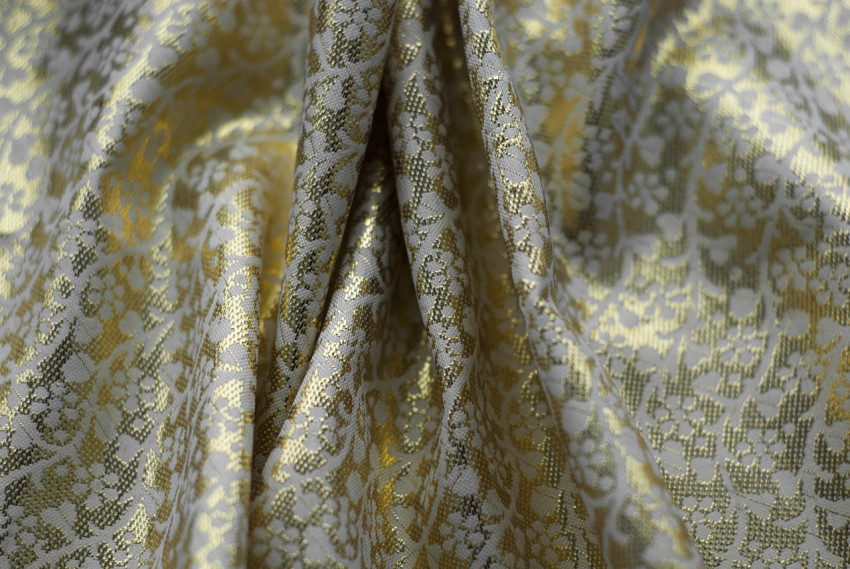 Folds of golden fabric