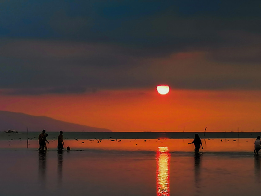 silhouettes of people at sunset