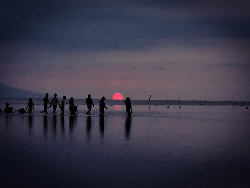 silhouettes of people at sunset