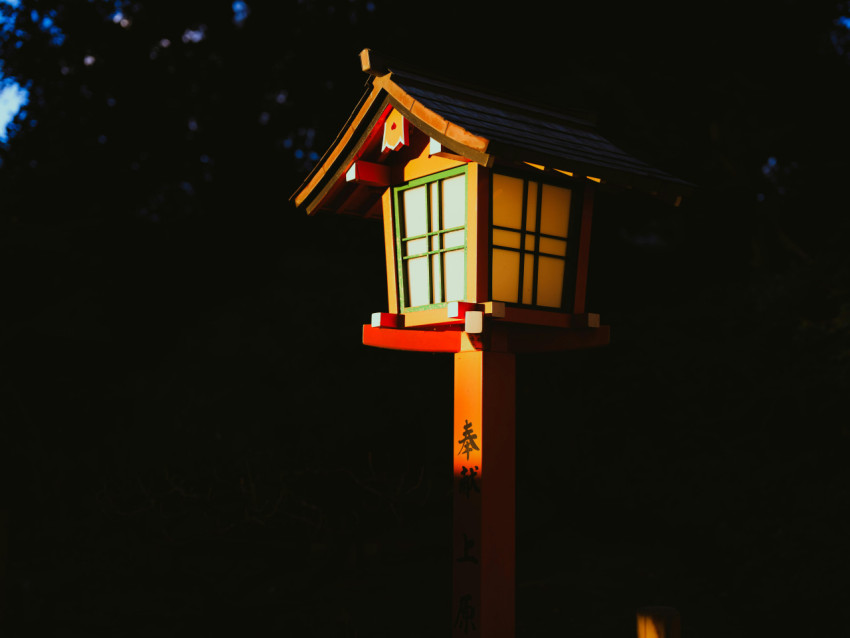 White cabin lit in the dark