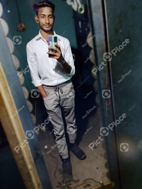 The guy takes a picture of himself in the mirror