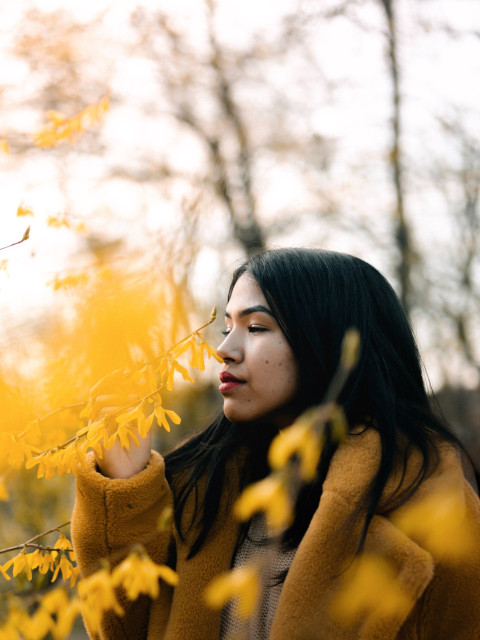 Woman smelling flowers