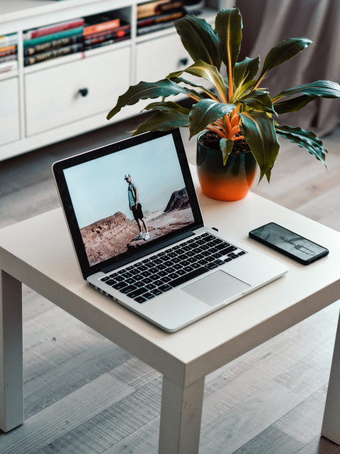 Macbook on white table