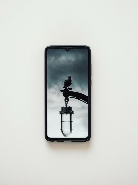 Black smartphone on white table