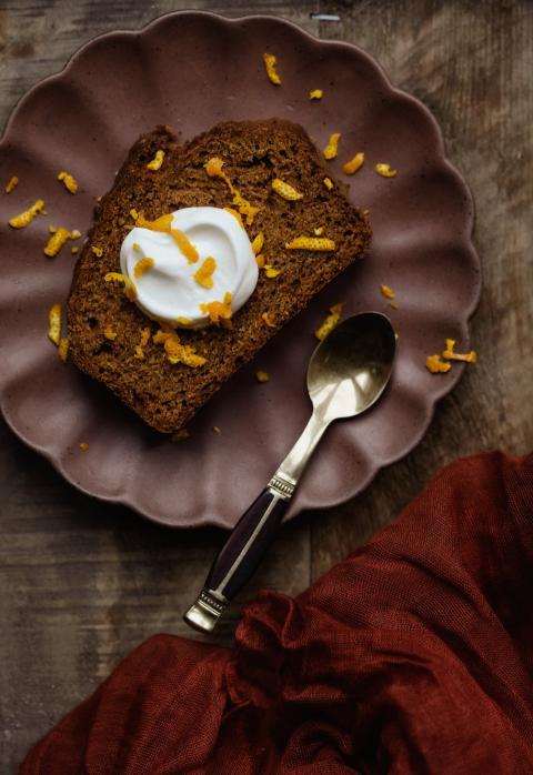 piece of cake on a plate with a spoon