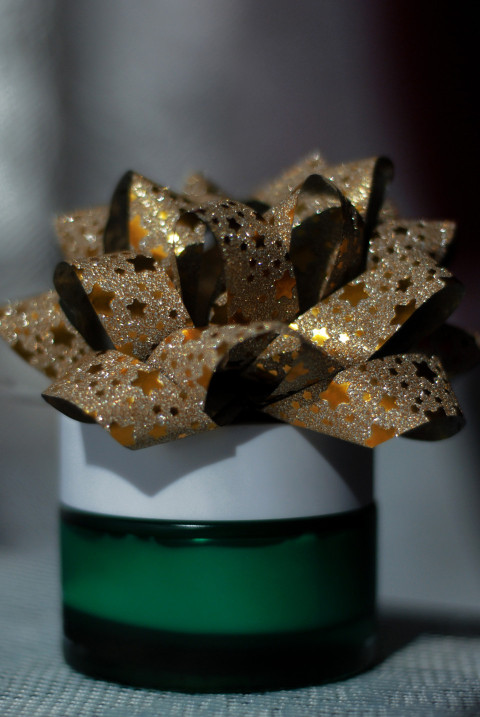 Festive bow on a tube of cream