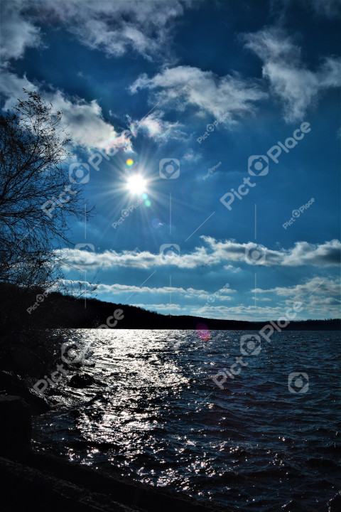 the sun over the lake