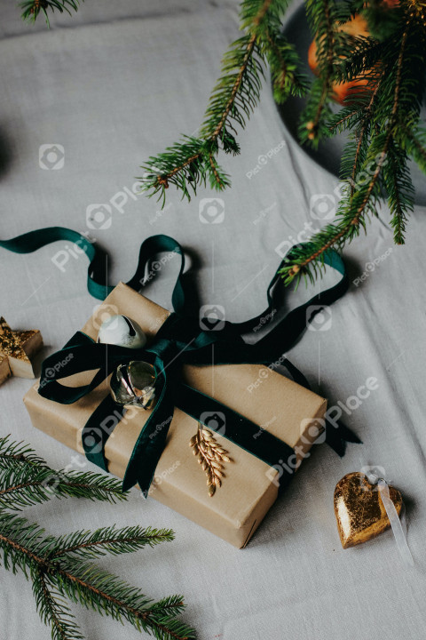 gift wrapped in brown paper with green ribbon
