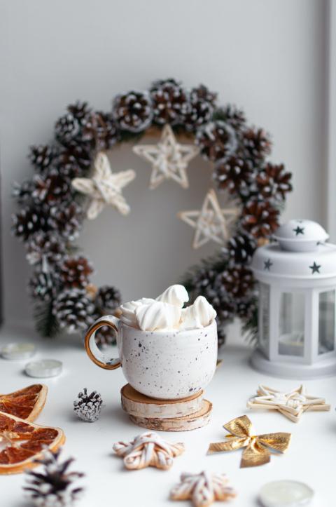 white table topped with a cup