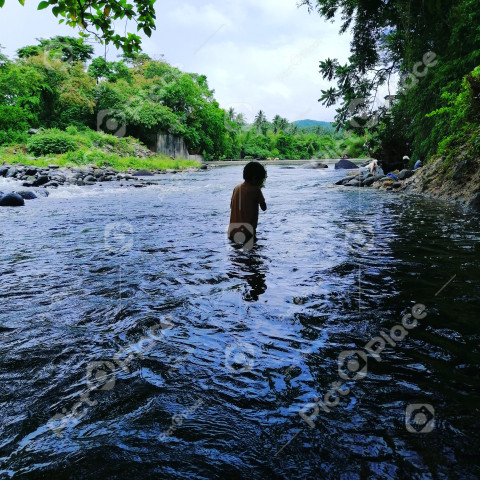 Boy bathing in the river